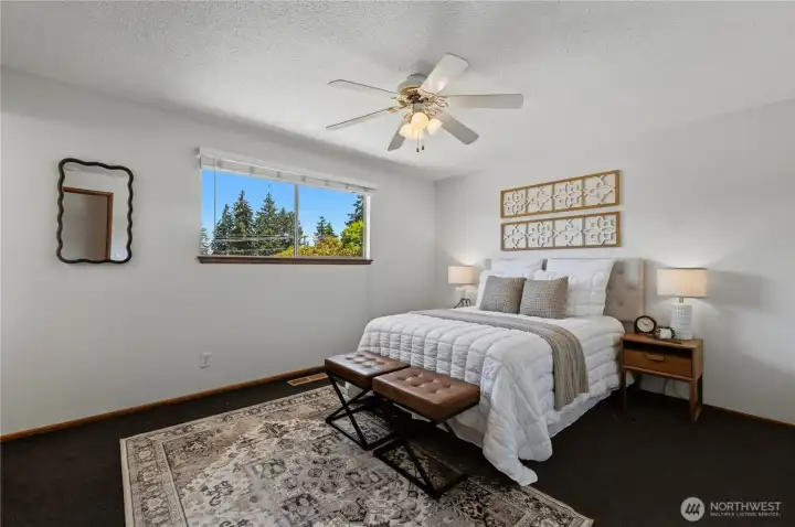 The primary bedroom offers ample space for a queen-sized bed and additional furnishings. The primary bedroom offers ample space for a queen-sized bed and additional furnishings.
