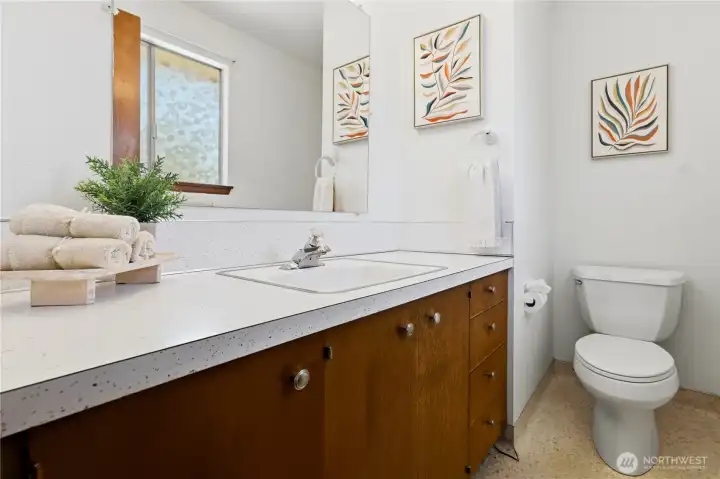 The primary half bath. The primary half bath.