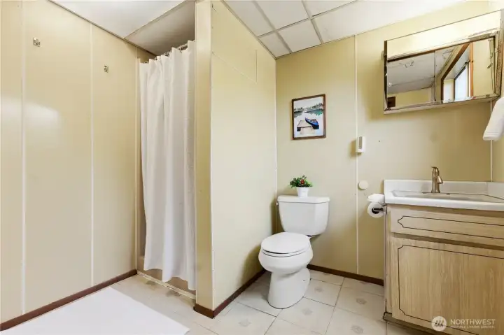 A convenient three-quarter bathroom is also located downstairs. A convenient three-quarter bathroom is also located downstairs.