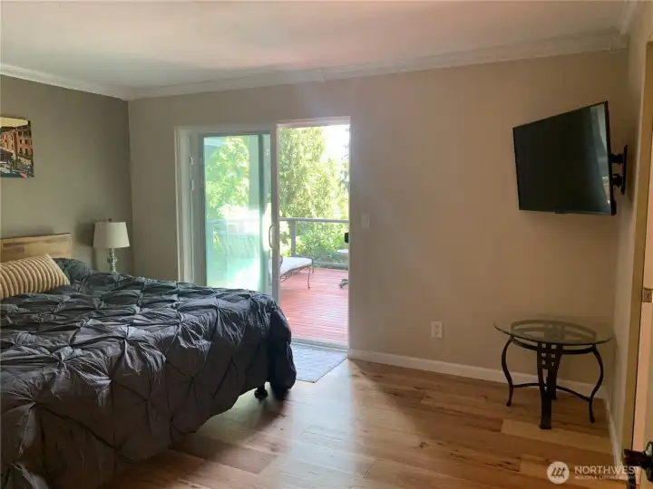 Master bedroom suite with sliding door to deck