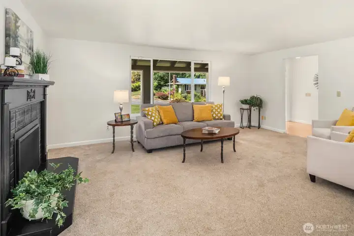 Step in to this extensively remodeled residence to find a bright, open, tri-level floor plan. Freshly painted throughout. The crisp living room welcomes you with an abundance of natural light, and is framed by a handsome gas fireplace.