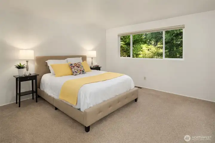 Relaxing primary suite with en suite 3/4 bath.