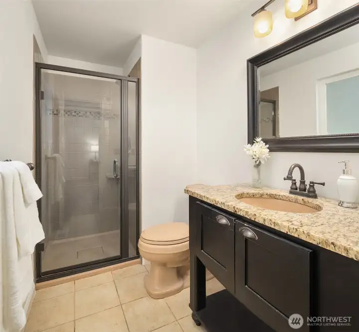 Relaxing primary suite with en suite 3/4 bath.