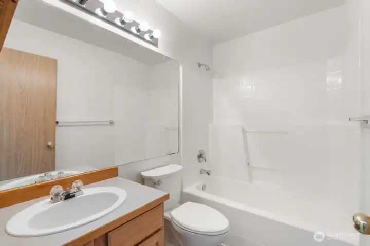 Shared bathroom with tub