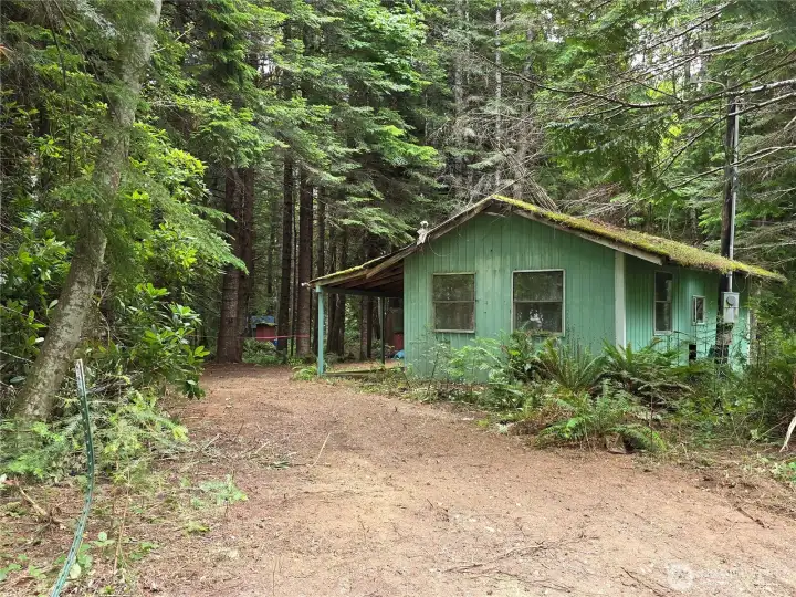 3rd of 3 driveways, RV cover with porch and a storage room