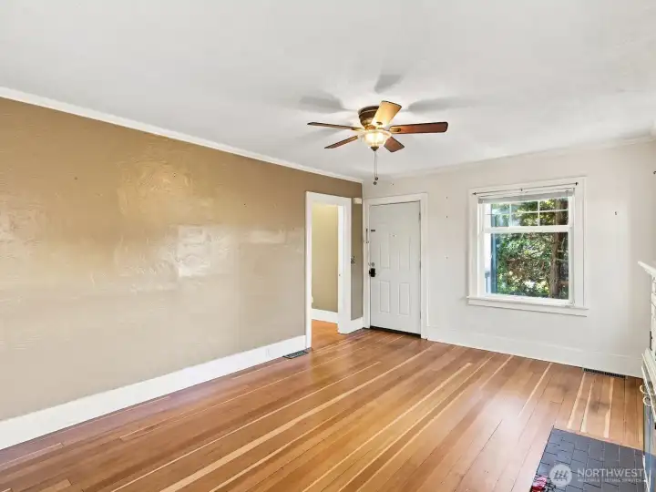 Mature landscaping surrounding the adorable front porch provides privacy from the street without blocking the light.
