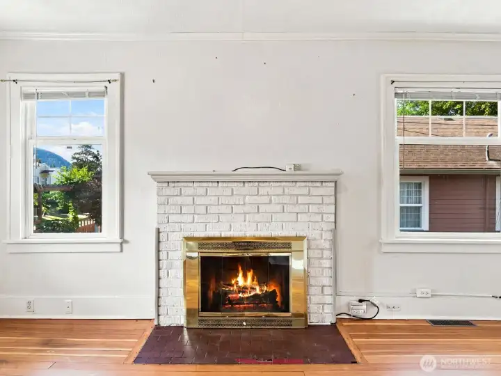 The electric fireplace provides a great ambiance in the spacious living room.
