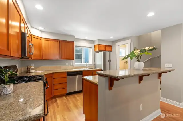 The sellers are "foodies" who love to cook. This kitchen layout was super functional and had plenty of counter space. The refrigerator is a newer Fisher & Paykel one.