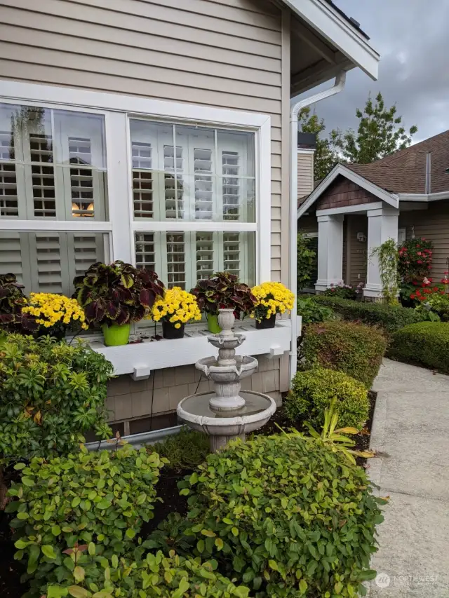 Spring view of front of condo with drip lines for watering.