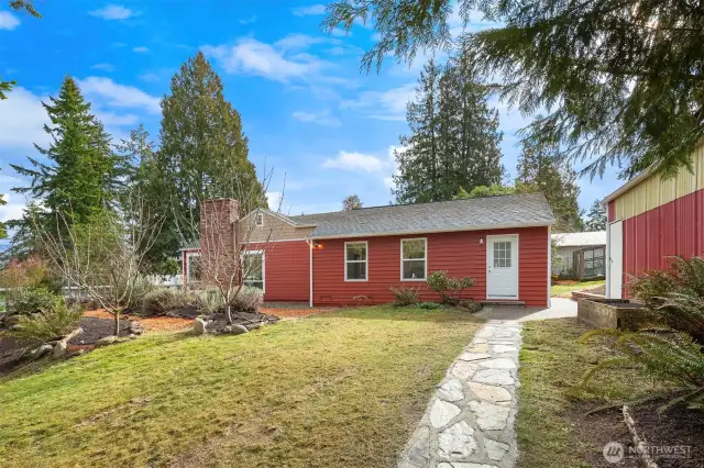 Although this is technically the side entrance, the owners preferred to enter the home through this door, which is adjacent to the large garage!