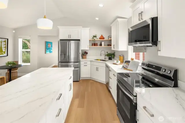 The vaulted ceilings in this light filled kitchen are stunning.