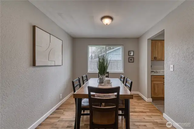 This dining room is located between the living room and kitchen.