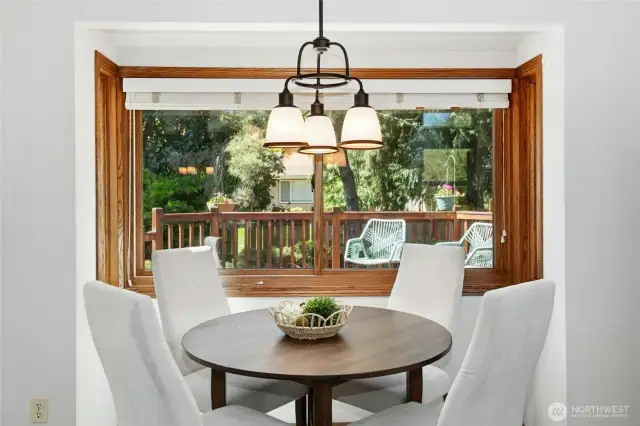Breakfast nook with seamless access to the expansive deck and backyard