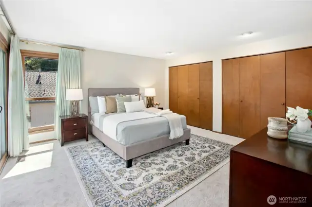 Primary suite featuring double closets for ample storage