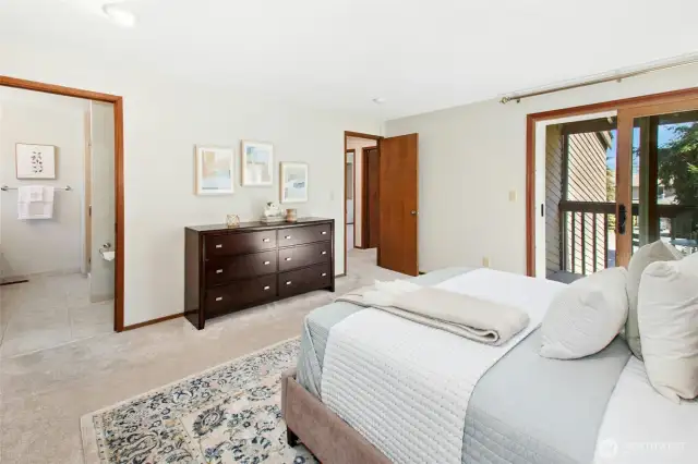 Primary suite with access to a private, covered deck — perfect for morning coffee