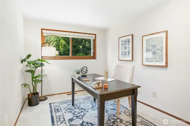 One of four secondary bedrooms, thoughtfully staged as a home office