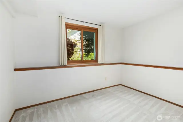 Fifth bedroom located on the lower level, perfect for guests or extended family