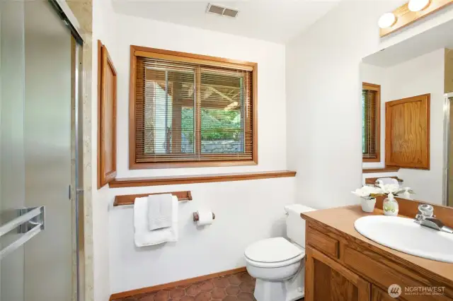 Lower-level bathroom situated just off the bonus room for added convenience