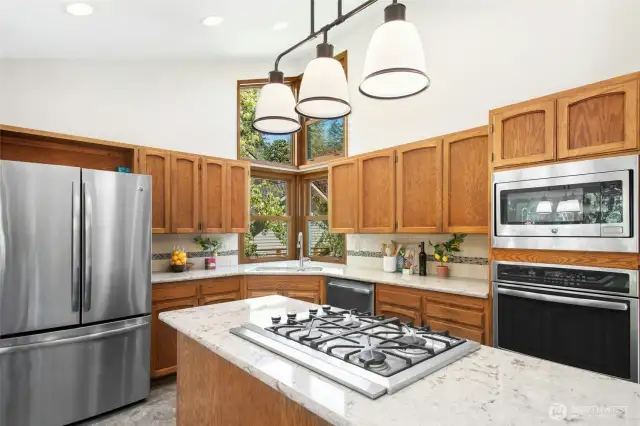 Chef’s kitchen featuring a center island, gas cooktop, and stainless steel appliances