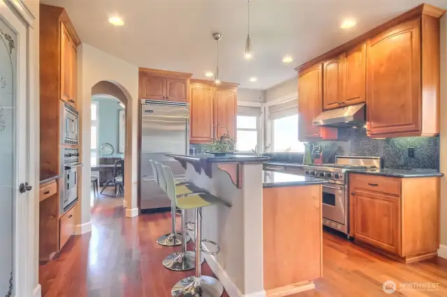 Gourmet kitchen with breakfast bar and double oven.