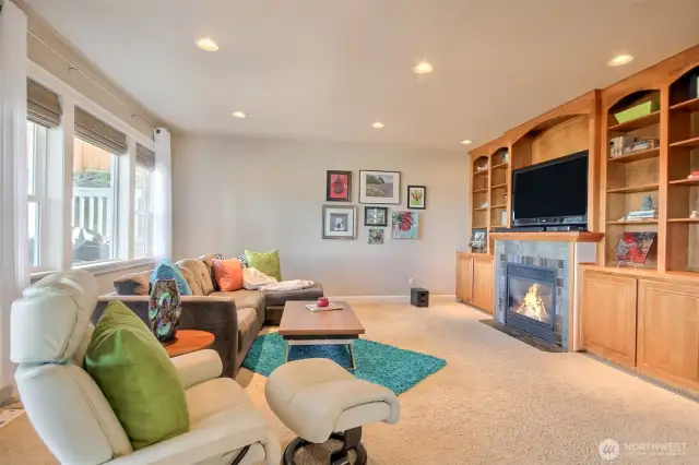 Family room with gas fireplace and built in bookcase.