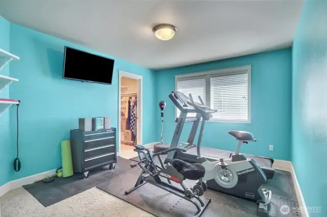 Bedroom #3 of 4 bedrooms is being used as a great workout room.