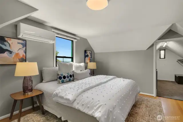 Large walk-in closet and attic storage.
