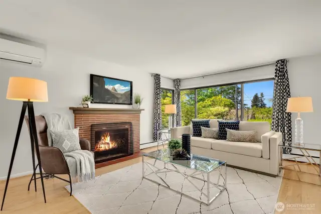 Enter into this bright and inviting living room with large windows.