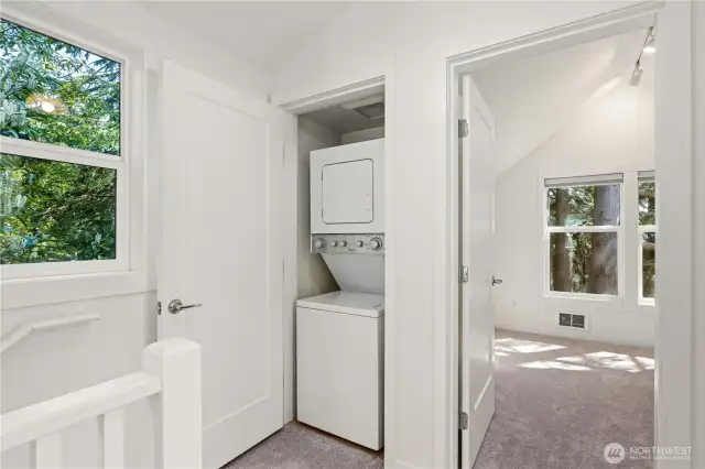 Head upstairs to check out both bedrooms, a full bathroom, and this handy laundry closet.