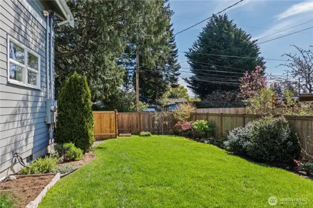 Surrounded by landscaping with plenty of room for pets, play and more gardens, summertime fun awaits here!