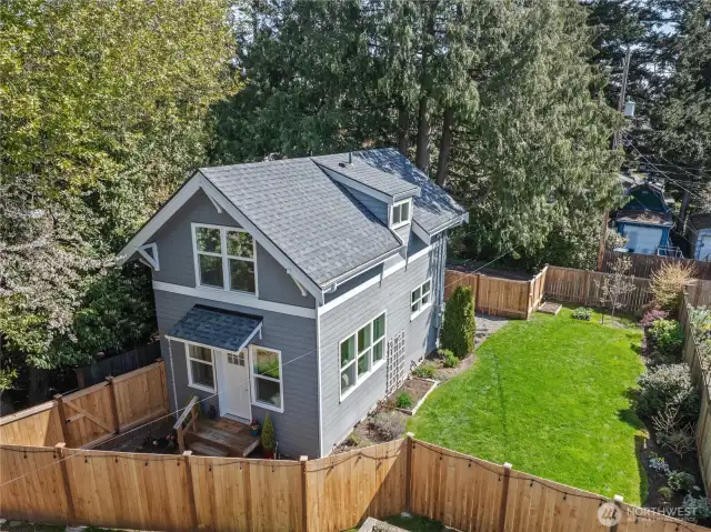Nestled back away from the street, this cute-as-a-button home enjoys great privacy, a beautiful garden setting, and LOTS of room for outdoor activities!