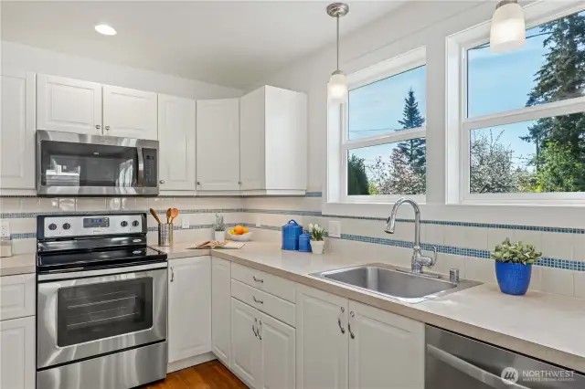 Washing dishes won't feel like such a chore when you get to look out these windows to your beautiful yard!