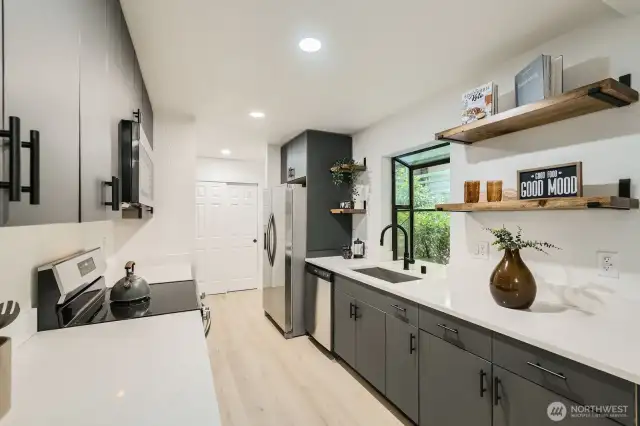 Fully updated kitchen w/ Matte black, flat panel Solid wood cabinets. Soft shut