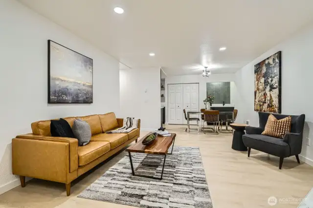 Open light and bright living area looking to dining area.