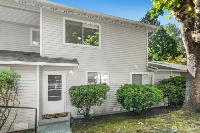 Charming front view nestled in a quiet neighborhood.