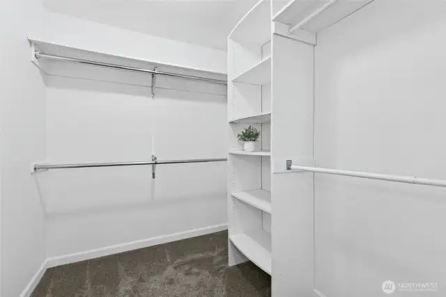 Spacious walk-in closet with ample storage.