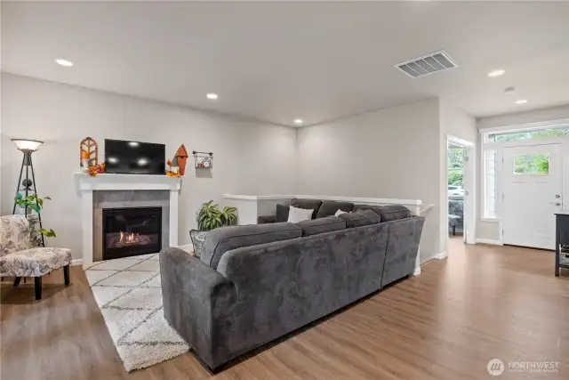 Entry on the main floor with gas fireplace in the Living Room.