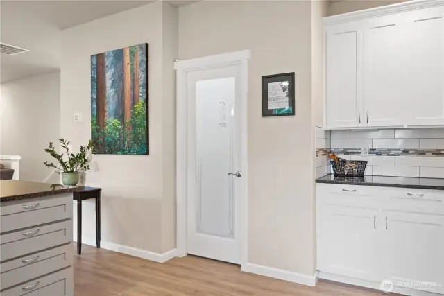 Custom frosted door to the walk-in kitchen pantry.