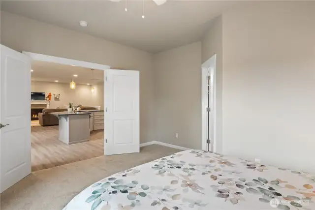 Primary Bedroom with French Doors to the Kitchen/Dining/Living Room