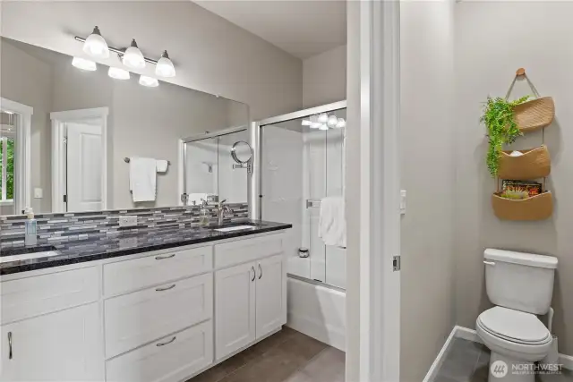 Primary Bathroom with door on water closet for privacy.