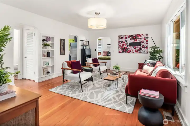 Living room with hardwood floors and curved entryways