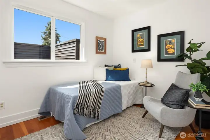 Bedroom with window and hardwood floor