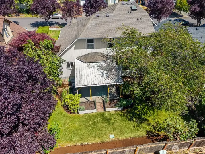Large lot with fully-fenced backyard, mature landscaping & trees, fruit trees, garden, covered patio, side yards, privacy and pavers throughout.