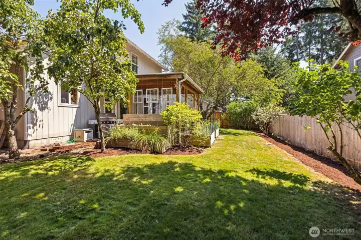 Large lot with fully-fenced backyard, mature landscaping & trees, fruit trees, garden, covered patio, side yards, privacy and pavers throughout.