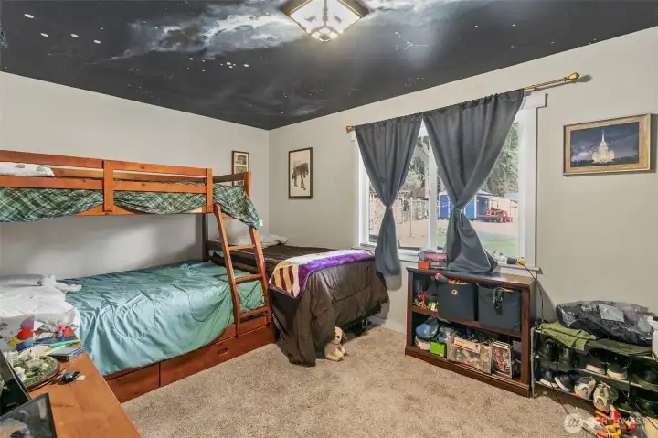 Second bedroom overlooks the deck and the forest.