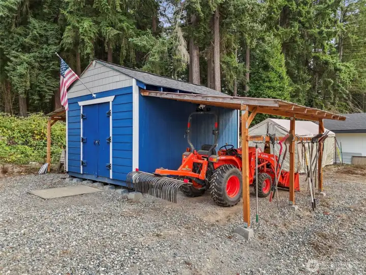 12x16' shed with two awnings for equipment storage.  Has electricity.