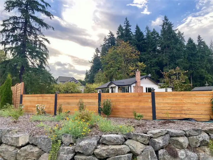 West facing side of home with entry to the driveway.