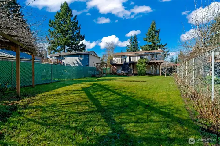 Fully fenced backyard is a gardener dream.