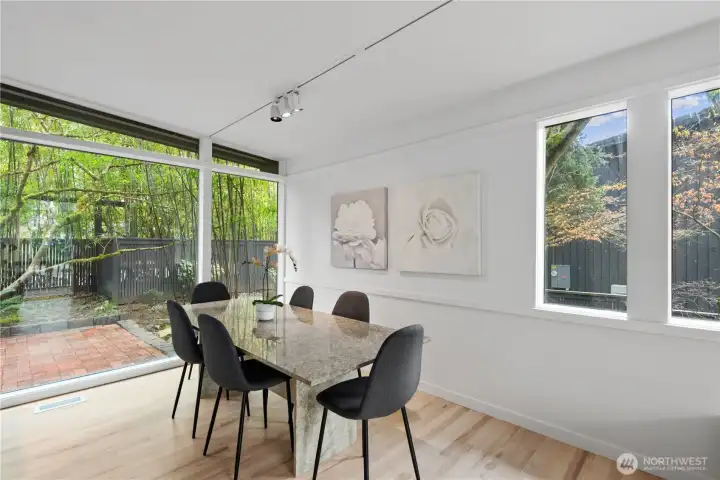 Spacious dining area connected to both kitchen and living spaces, offering great natural light and an open-concept feel.
