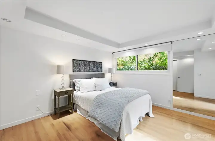 Oversized primary suite with dual closets and private ensuite bath.